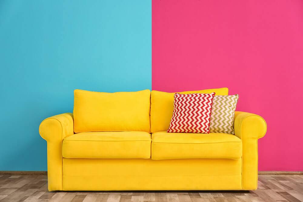 yellow sofa with pink and blue walls